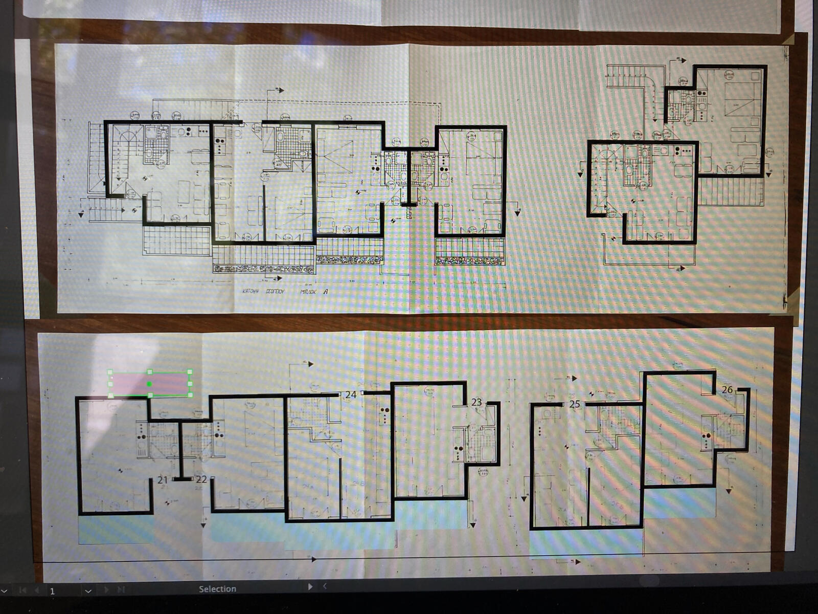 Black lines are illustrated over a photo of the schematics.